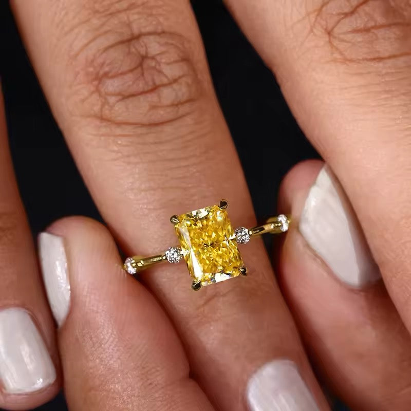 Yellow gemstone ring on model’s hand