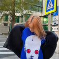 Aesthetic streetwear sweater with a creepy anime face design, perfect for edgy e-girl style