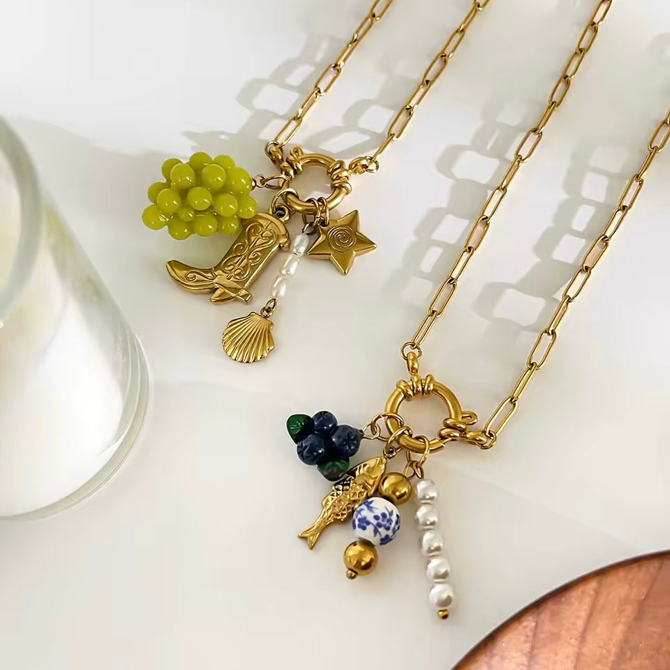 Trendy and unique statement necklace featuring a blueberry pendant