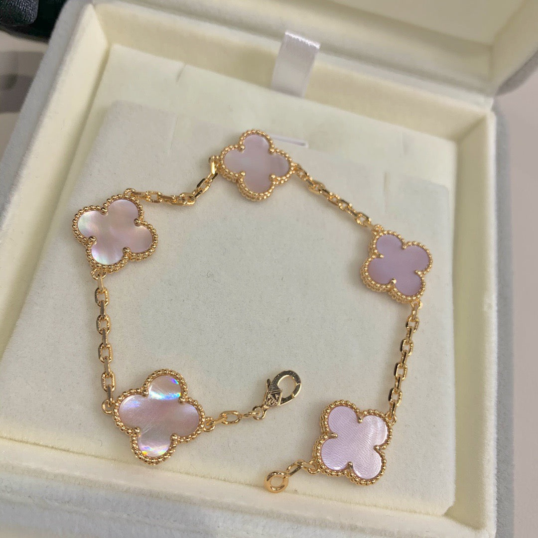Elegant pink clover bracelet with 18K gold-plated finish and soft enamel charm