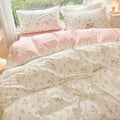 Coquette floral bedding set with pink duvet cover flat sheet and pillowcases in bright bedroom
