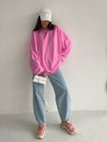 Round neck women’s long sleeve shirt in solid pink color