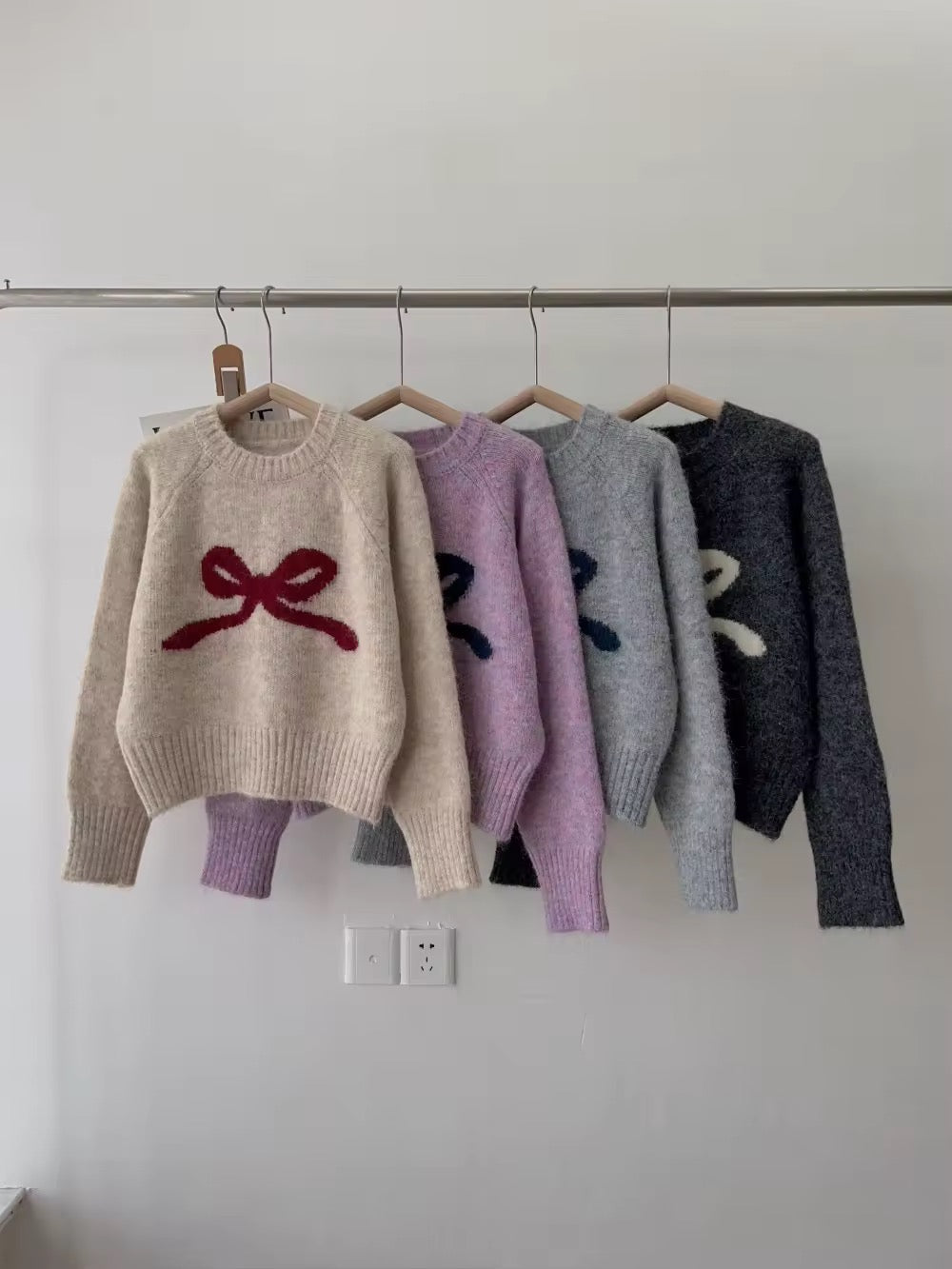 Close-up of soft knit texture and bow accent