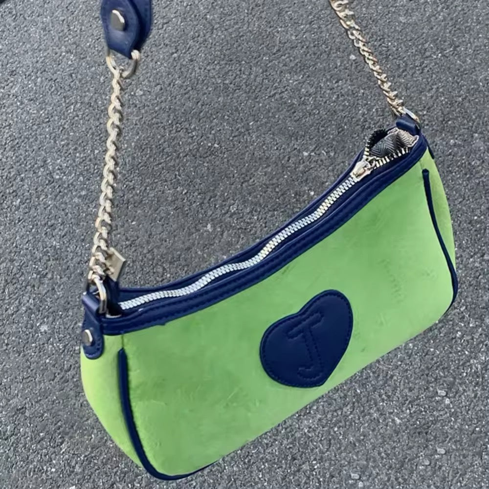 Side angle highlighting the bag's compact size and elegant design.