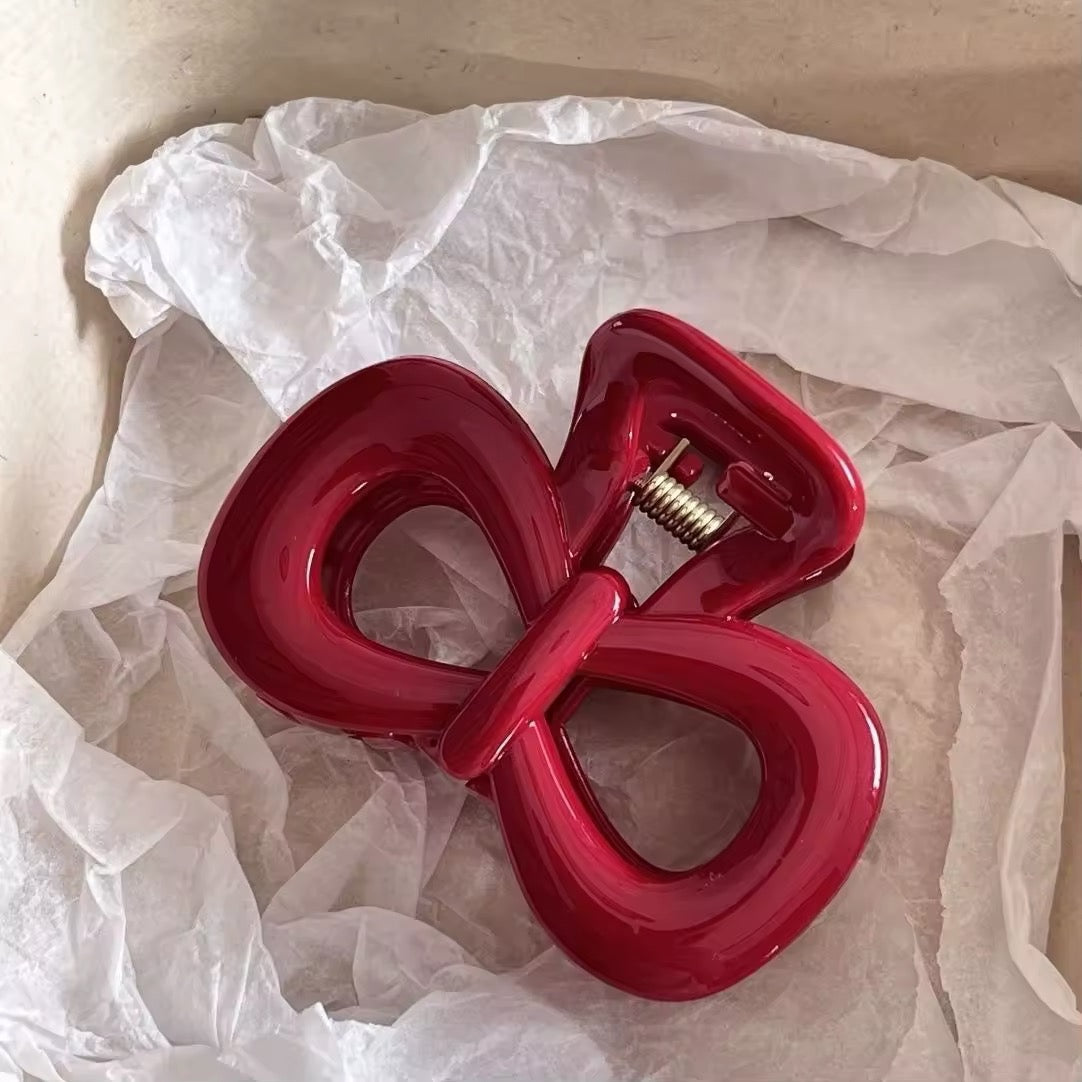 Korean-style red bow shark claw hair clip for stylish looks