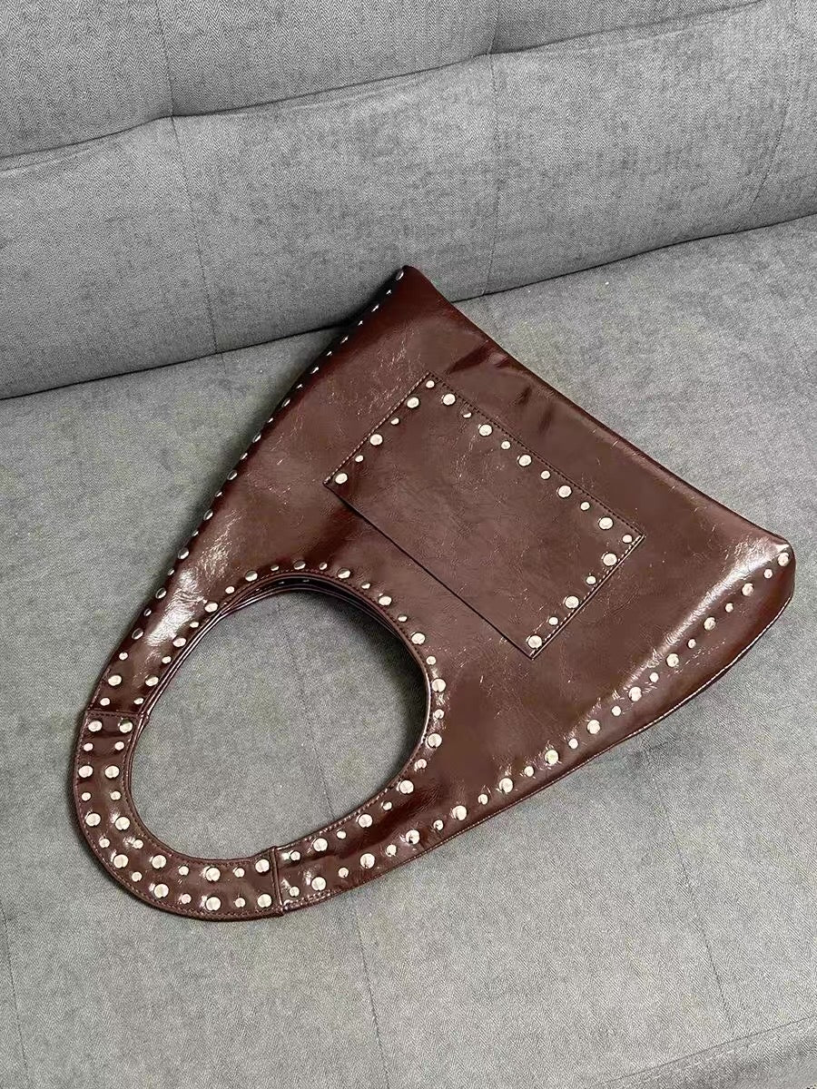 Vintage Maillard tone leather bag styled with motorcycle outfit