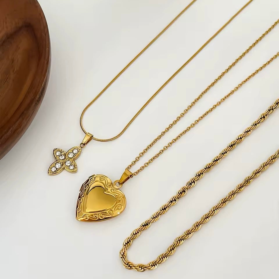 Elegant stainless steel twisted chain necklace with cross and heart charm