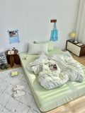Bedroom with a neatly made bed and minimal decor