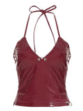 Punk-inspired leather camisole with metal button accents