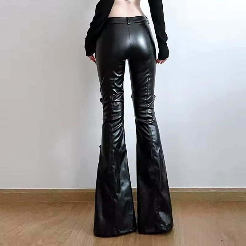 Low-waisted gothic PU leather pants, Y2K-inspired flared trousers with buckle strap details, perfect for streetwear, punk, and alternative fashion outfits