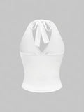 White halter top on a gray background