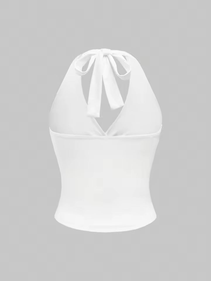 White halter top on a gray background