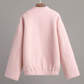 Soft girl aesthetic pink jacket with warm fluffy texture and side pockets, perfect for pastel layering