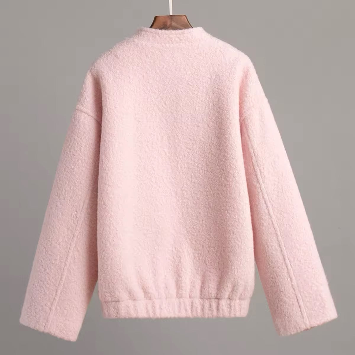 Soft girl aesthetic pink jacket with warm fluffy texture and side pockets, perfect for pastel layering