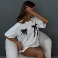 Cute Korean fashion T-shirt with bow print, oversized fit and breathable cotton material, a great choice for everyday Y2K outfits