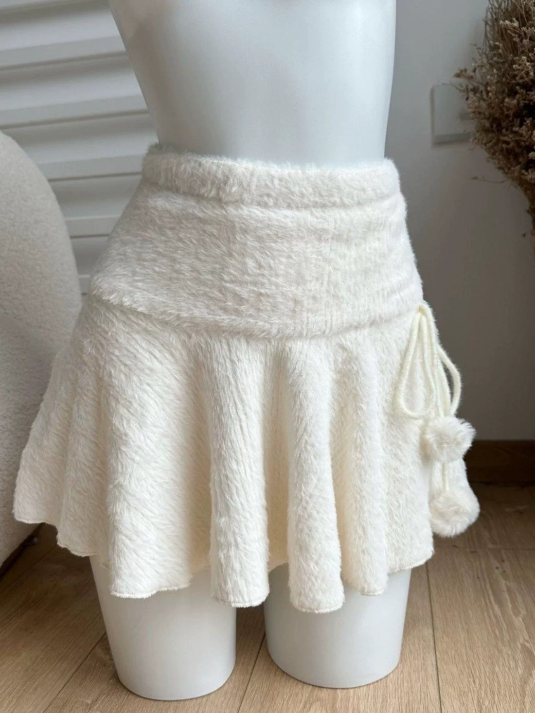Japanese streetwear white mini skirt on soft background