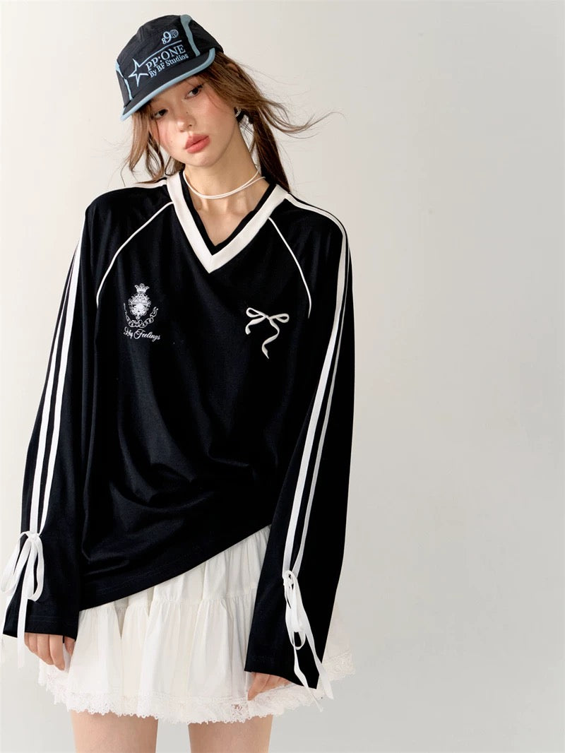 Model wearing the white top with minimal accessories for a clean sporty aesthetic.