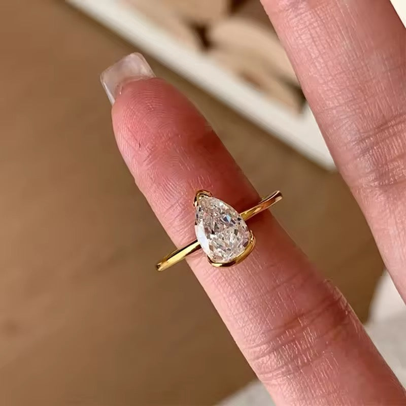Minimalist silver ring with water drop gem