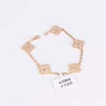 Elegant gold bracelet featuring a lucky clover with crystals