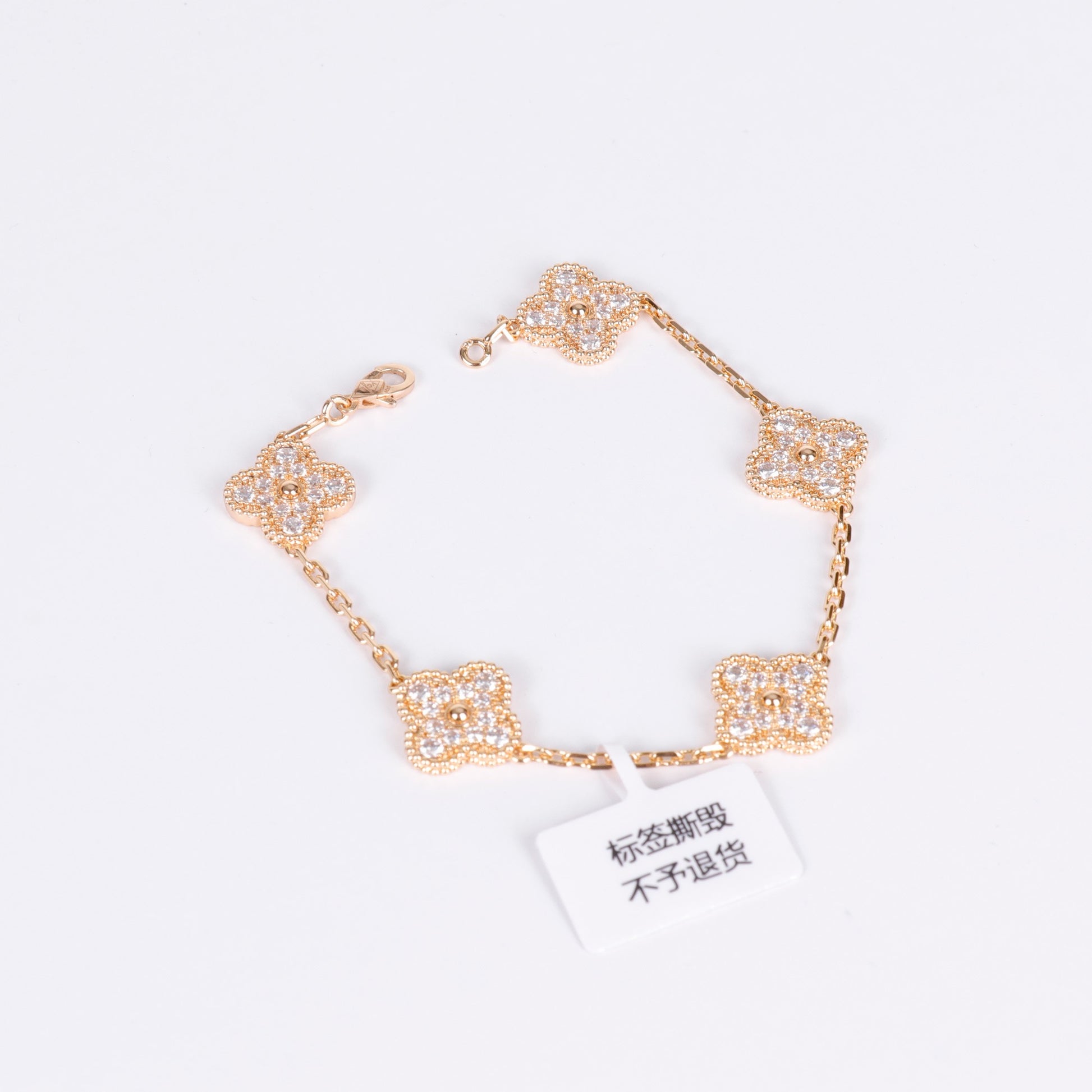 Elegant gold bracelet featuring a lucky clover with crystals