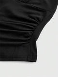 Close-up of a black garment on a light gray background