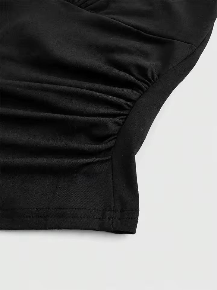 Close-up of a black garment on a light gray background