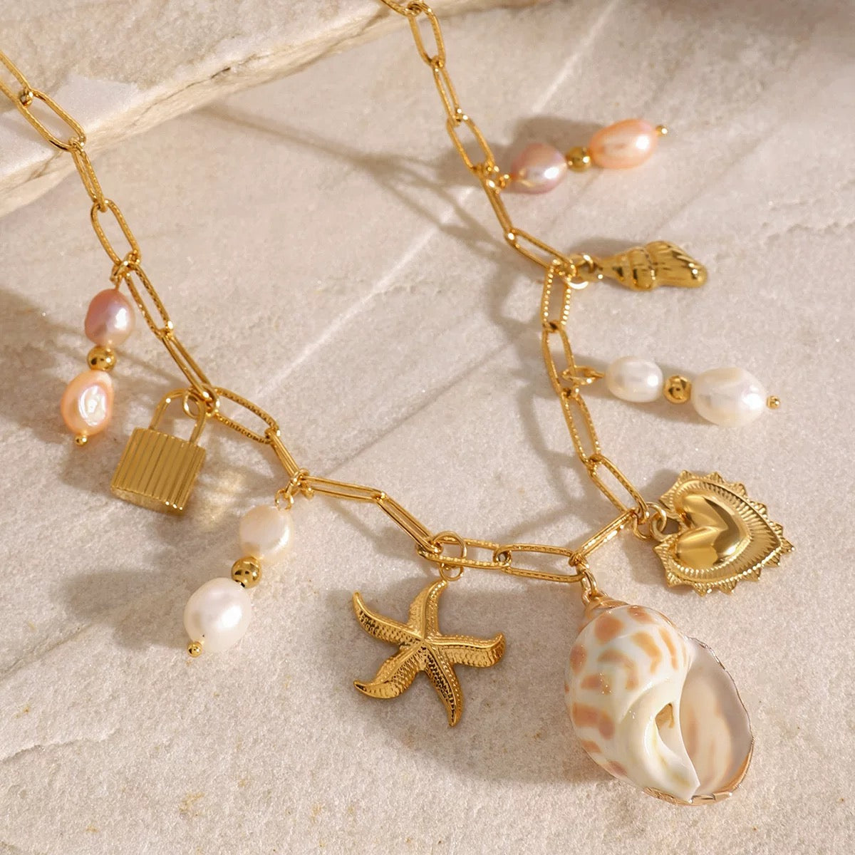 Stylish coastal girl necklace with shell and heart charm