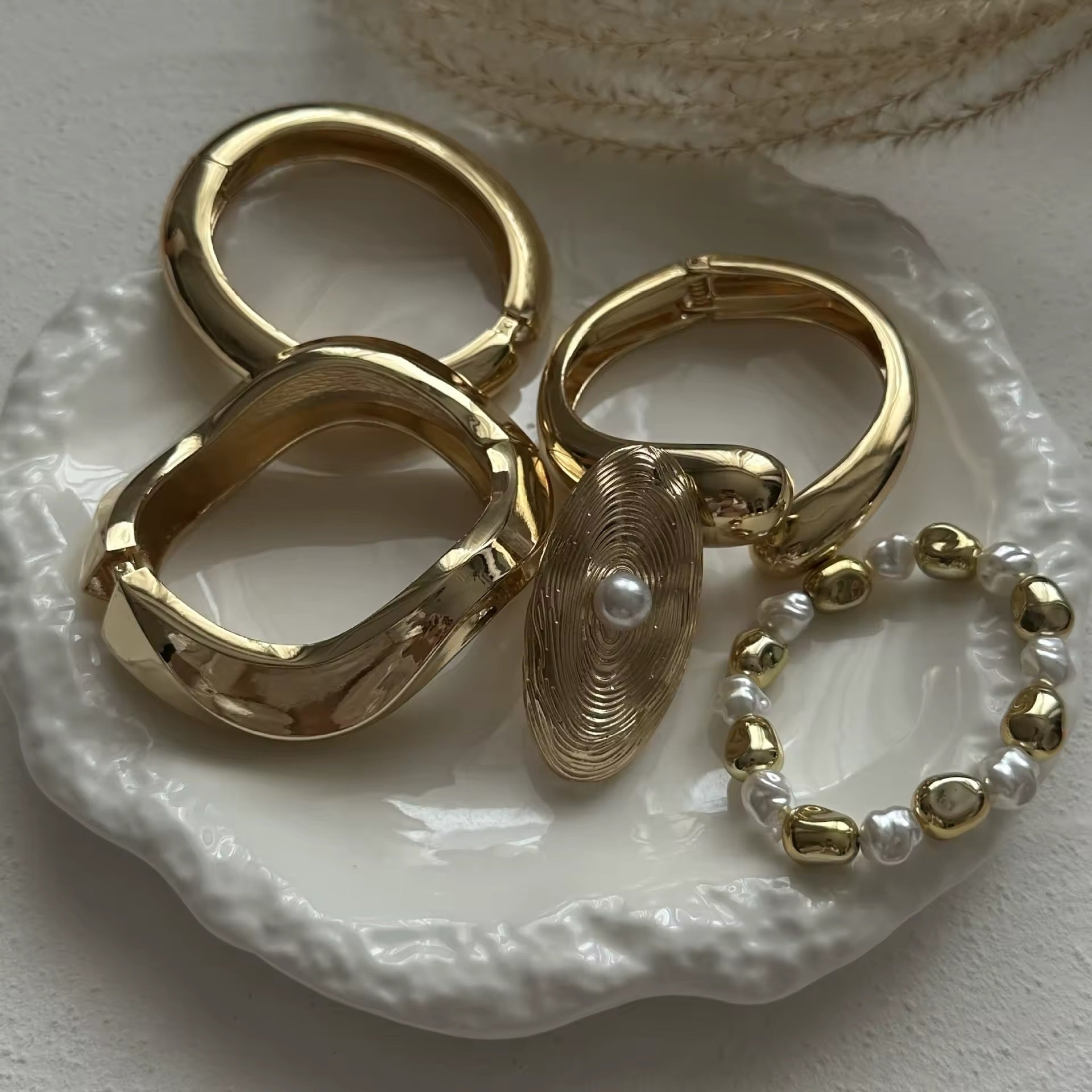 Elegant metal bracelet with a unique, curved shape