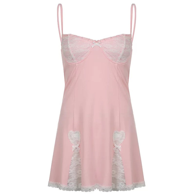 Sweet pink coquette mini dress with lace and bow for summer