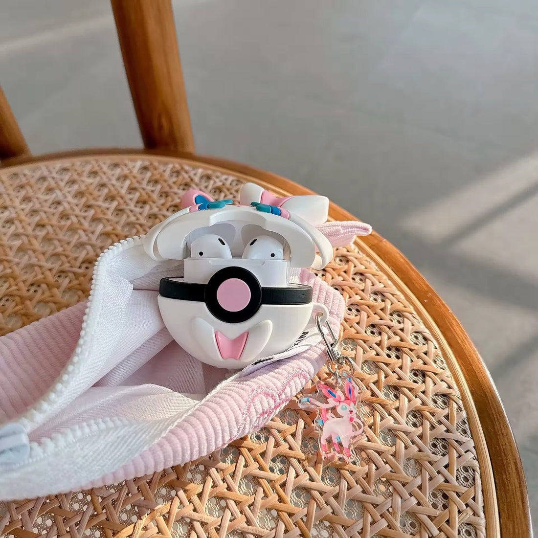Poké Ball AirPods case with Sylveon design