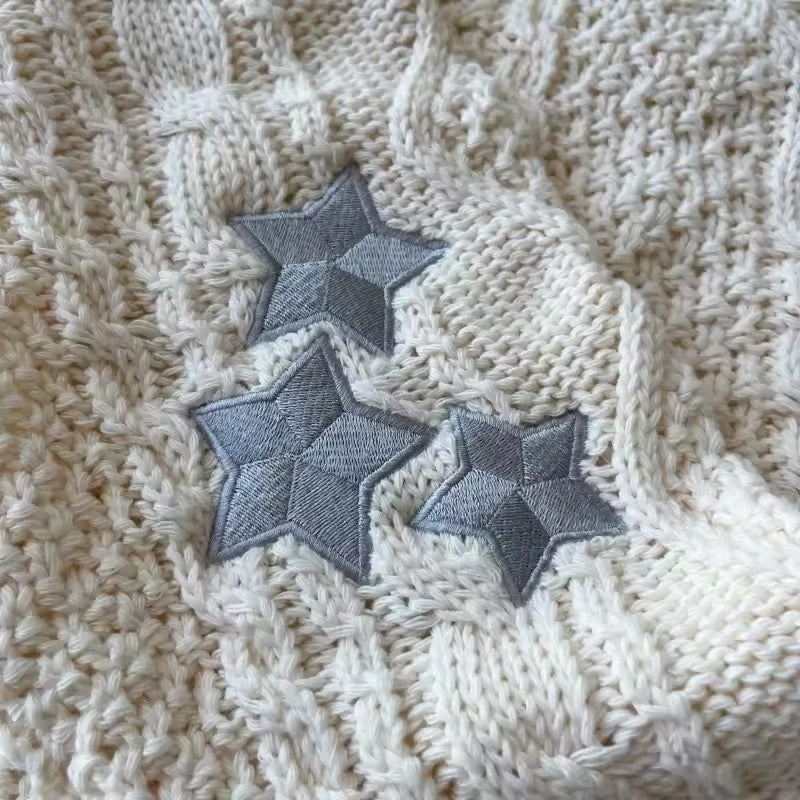 Star embroidered aesthetic cardigan layered over dress