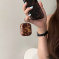 Side view of glossy amber earphone case