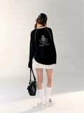 Korean fashion model showcasing balletcore sporty style in black jersey.