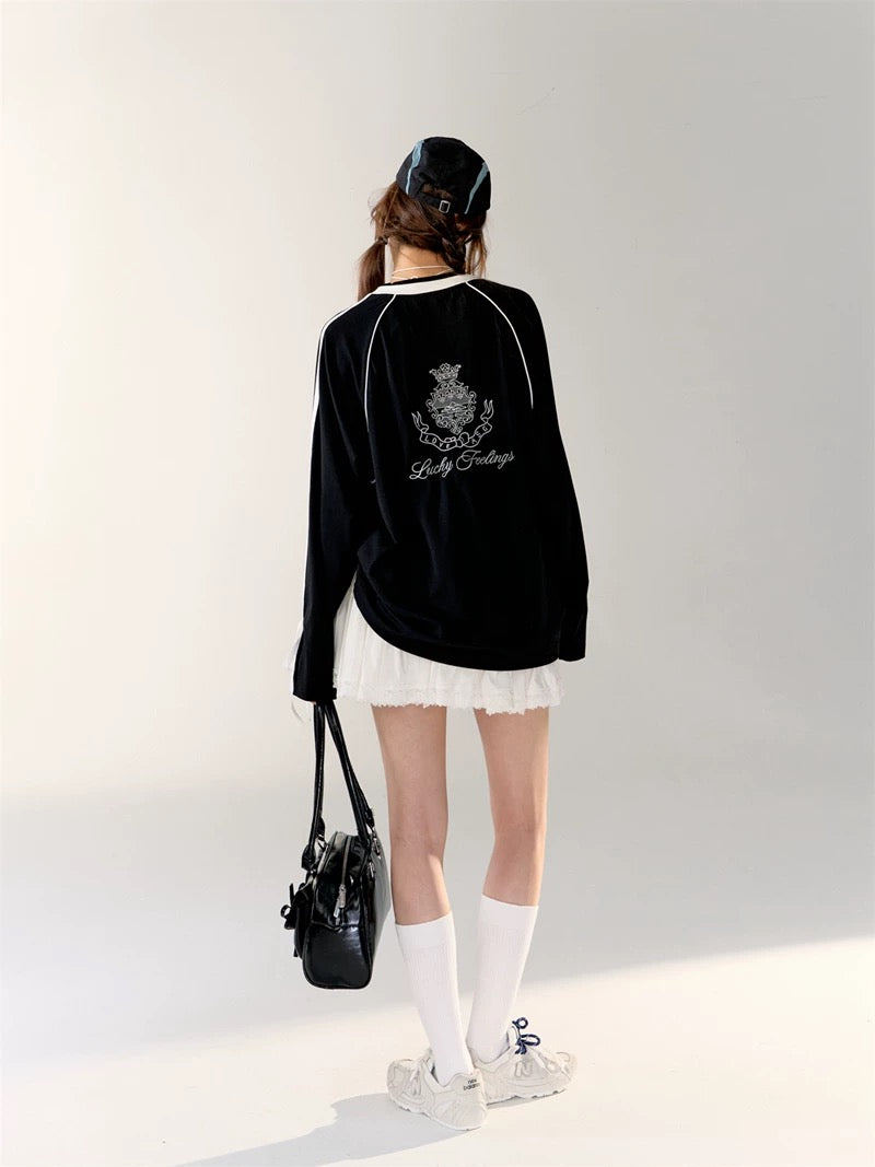 Korean fashion model showcasing balletcore sporty style in black jersey.