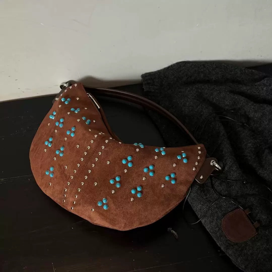 Vintage aesthetic handbag with rivets and boho floral bead accents