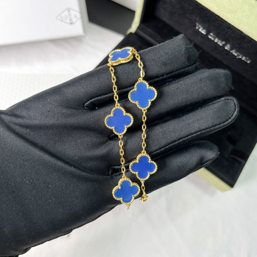 Designer clover bracelet with pastel blue and gold contrast