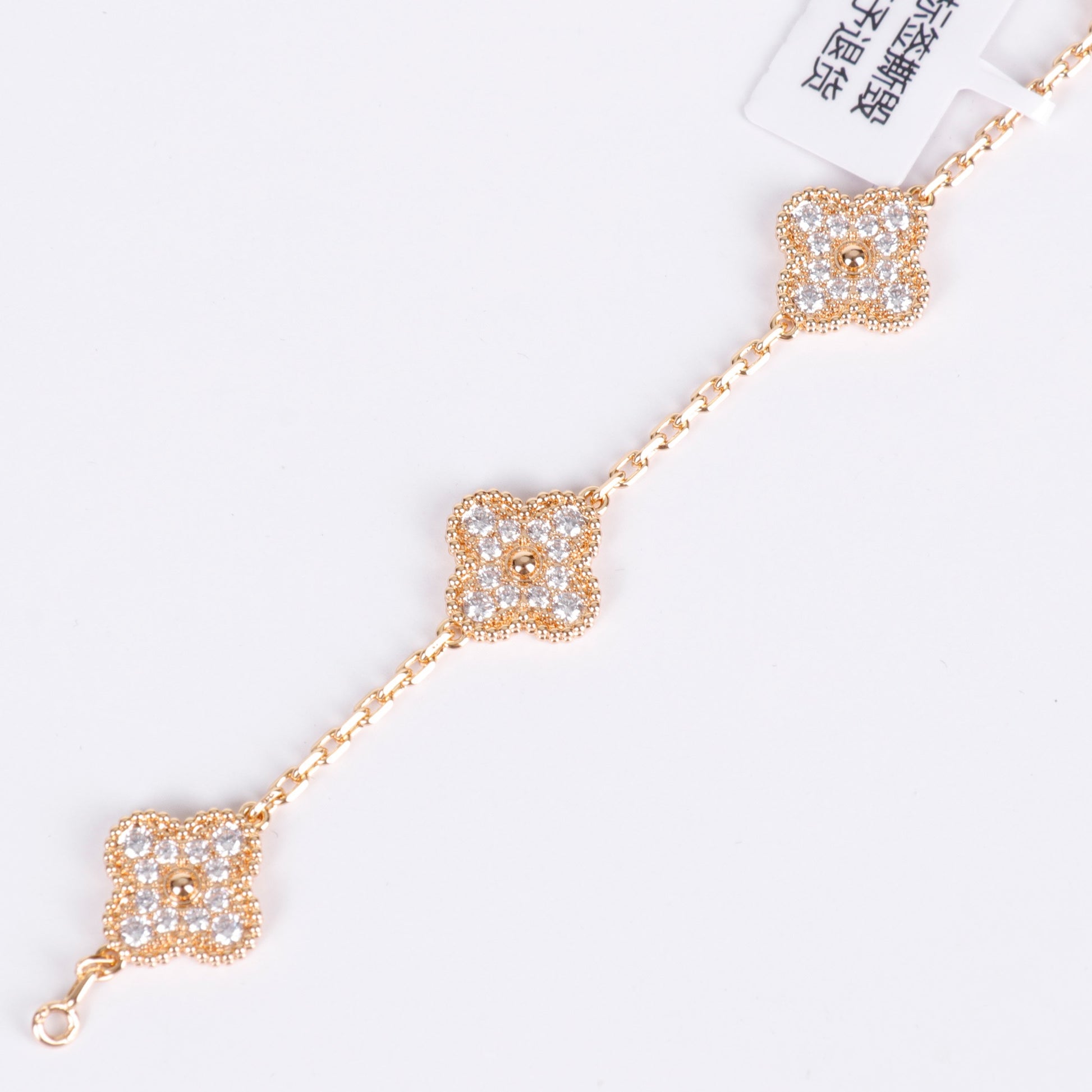 V-Gold bracelet with crystal clover charm and polished shine