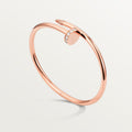 Bold gold nail bracelet with crystal highlights, aesthetic and edgy