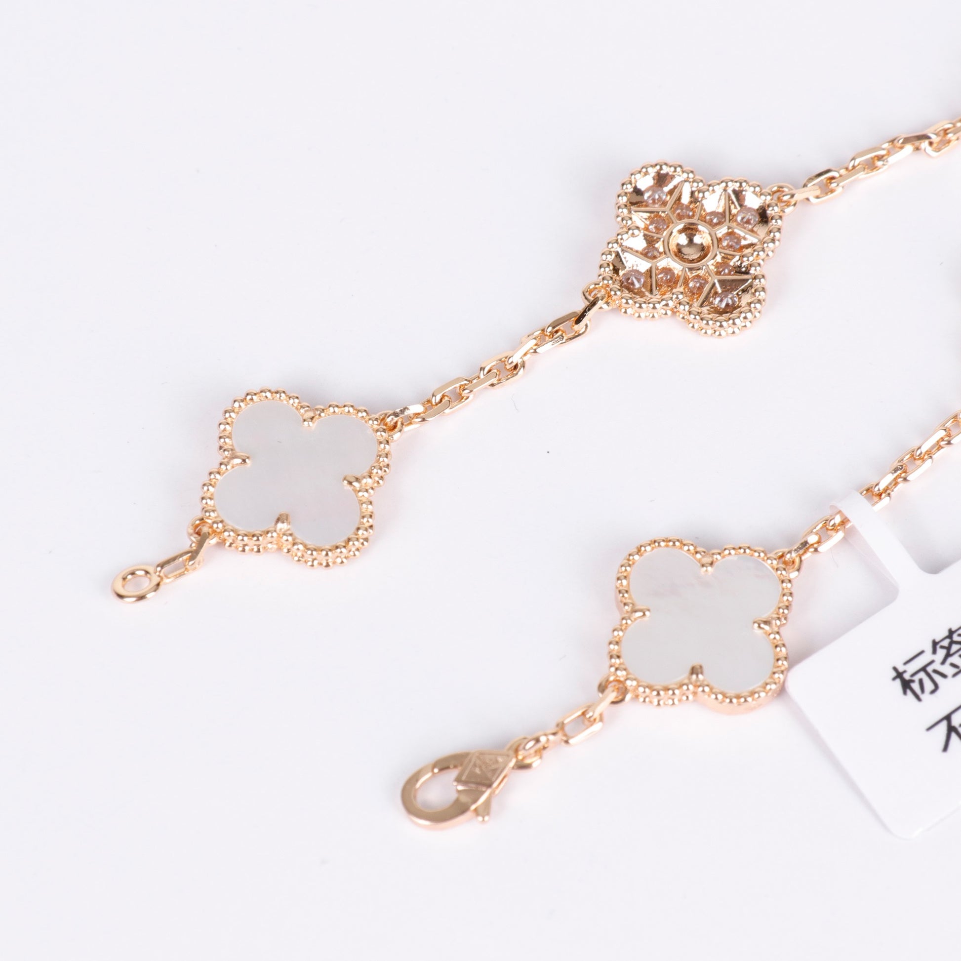 Polished gold bracelet with elegant enamel and crystal detail