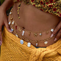 Pearl belly chain with a delicate 18K gold-plated link construction.
