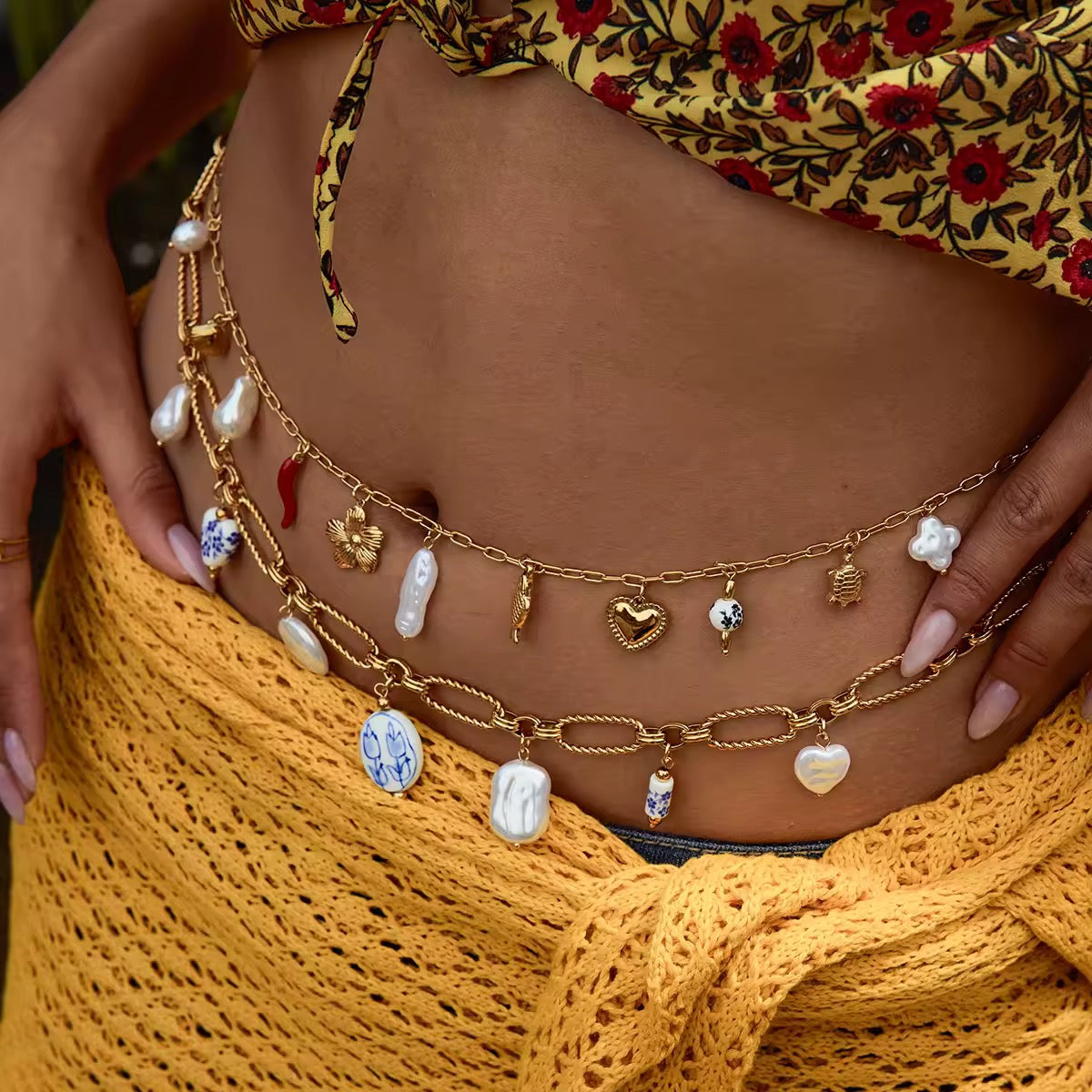 Pearl belly chain with a delicate 18K gold-plated link construction.