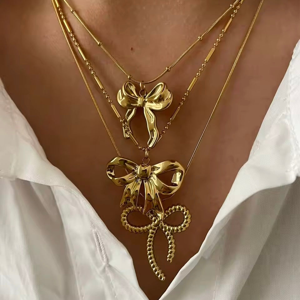 Stylish and trendy coquette aesthetic gold bow pendant necklace