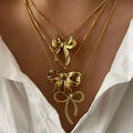Stylish and trendy coquette aesthetic gold bow pendant necklace