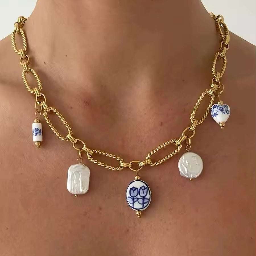 Vintage pearl ceramic necklace with gold-plated chain