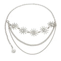 Vintage metal waist chain belt with layered sun charm design, styled over dress