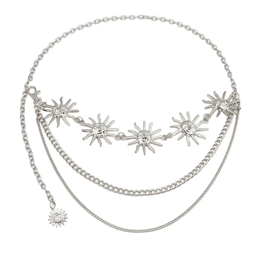 Vintage metal waist chain belt with layered sun charm design, styled over dress