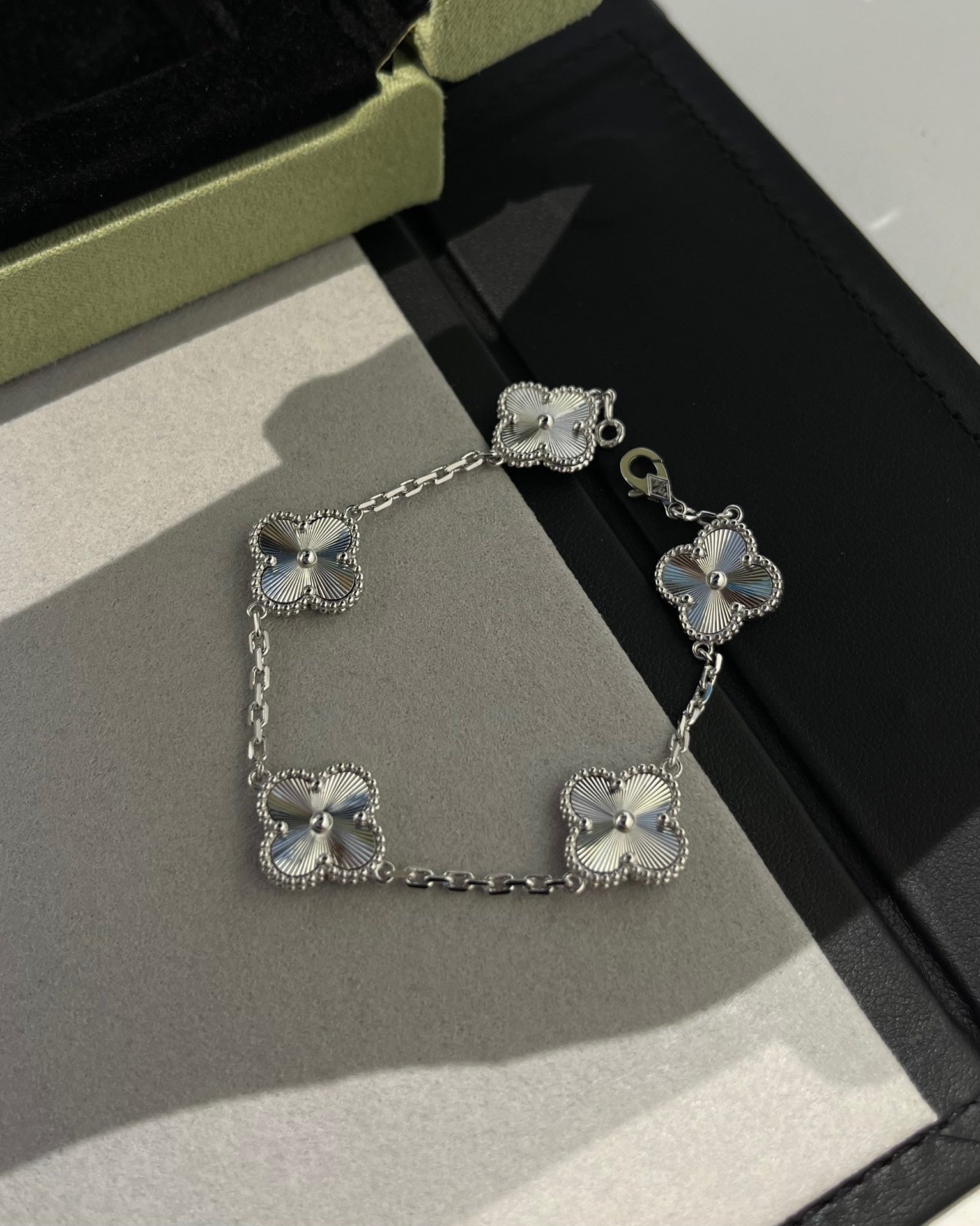 White gold laser clover bracelet with minimalist engraved detail
