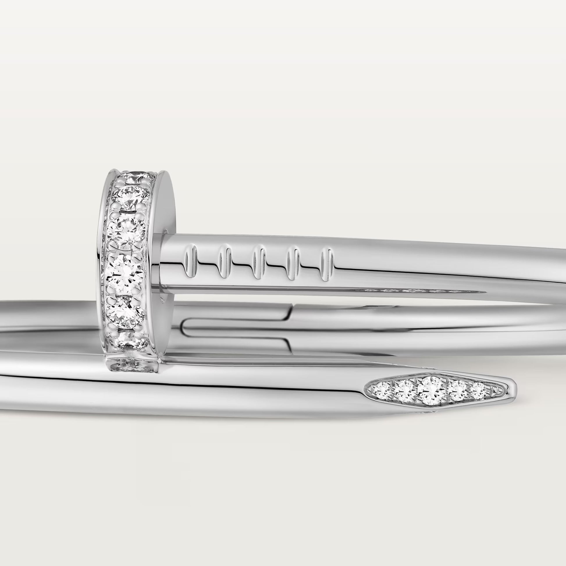 Elegant white gold nail bracelet with crystals and sleek 18K finish