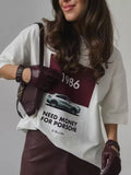 Stylish white streetwear tee with Porsche quote