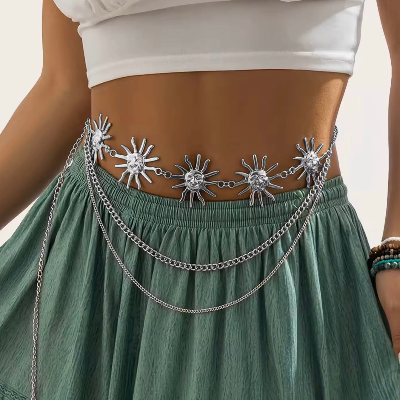 Bold celestial waist belt with layered chains and sun charm
